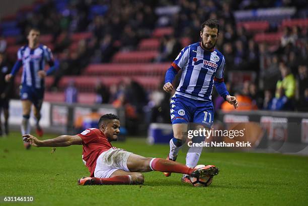 Adam Le Fondre of Wigan Athletic and Michael Mancienne of Nottingham Forest in action during the Emirates FA Cup Third Round match between Wigan...