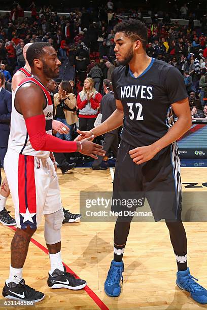 John Wall of the Washington Wizards and Karl-Anthony Towns of the Minnesota Timberwolves shake hands after the game on January 6, 2017 at Verizon...