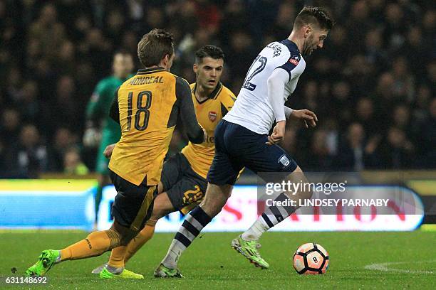 Preston's Scottish midfielder Paul Gallagher vies with Arsenal's Spanish defender Nacho Monreal during the English FA Cup third round football match...