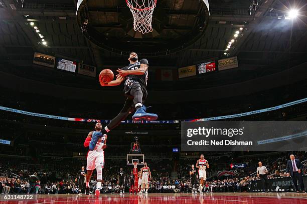 Karl-Anthony Towns of the Minnesota Timberwolves throws down a windmill dunk during the game against the Washington Wizards on January 6, 2017 at...
