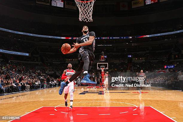 Karl-Anthony Towns of the Minnesota Timberwolves throws down a windmill dunk during the game against the Washington Wizards on January 6, 2017 at...