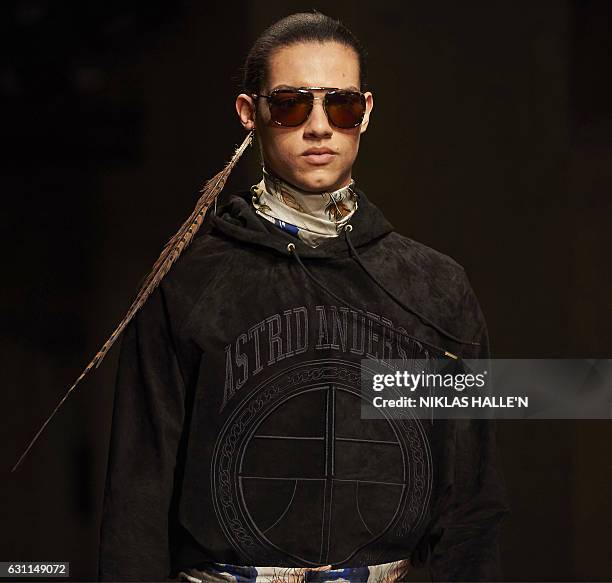 Model presents a creation by fashion designer Astrid Andersen on the second day of the Autumn/Winter 2017 London Fashion Week Men's fashion event in...