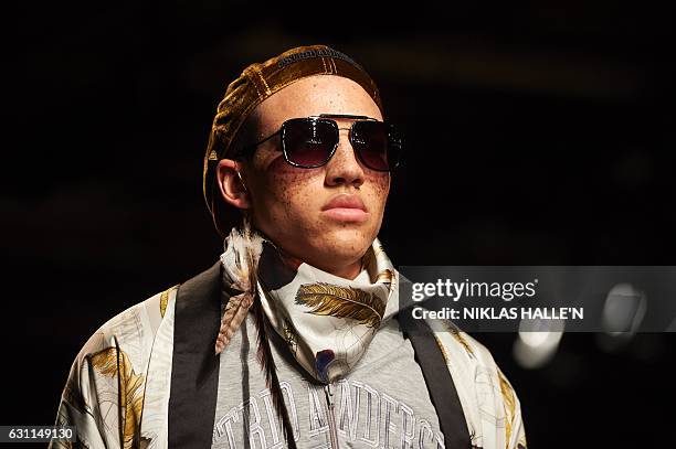 Model presents a creation by fashion designer Astrid Andersen on the second day of the Autumn/Winter 2017 London Fashion Week Men's fashion event in...