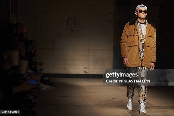 Model presents a creation by fashion designer Astrid Andersen on the second day of the Autumn/Winter 2017 London Fashion Week Men's fashion event in...