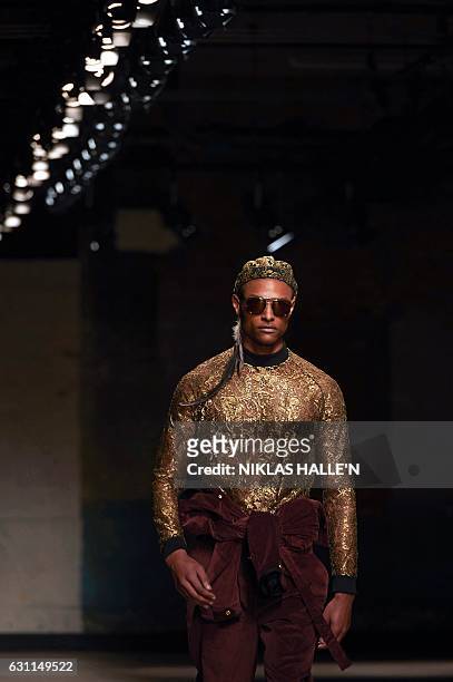 Model presents a creation by fashion designer Astrid Andersen on the second day of the Autumn/Winter 2017 London Fashion Week Men's fashion event in...