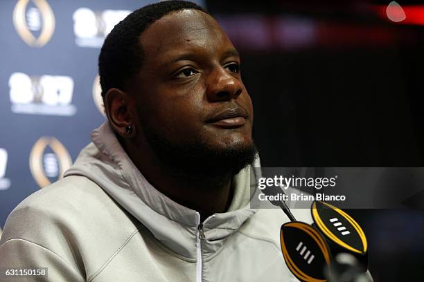 Offensive lineman Cam Robinson of the Alabama Crimson Tide speaks to the media during the College Football Playoff National Championship Media Day on...