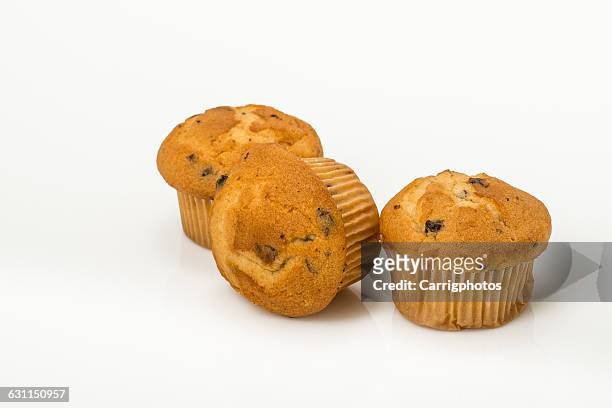 three blueberry muffins on white background - muffin stock pictures, royalty-free photos & images
