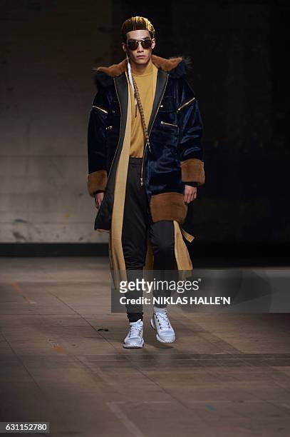 Model presents a creation by fashion designer Astrid Andersen on the second day of the Autumn/Winter 2017 London Fashion Week Men's fashion event in...