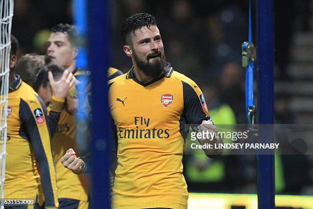 Arsenal's French striker Olivier Giroud celebrates after scoring their second goal during the English FA Cup third round football match between...