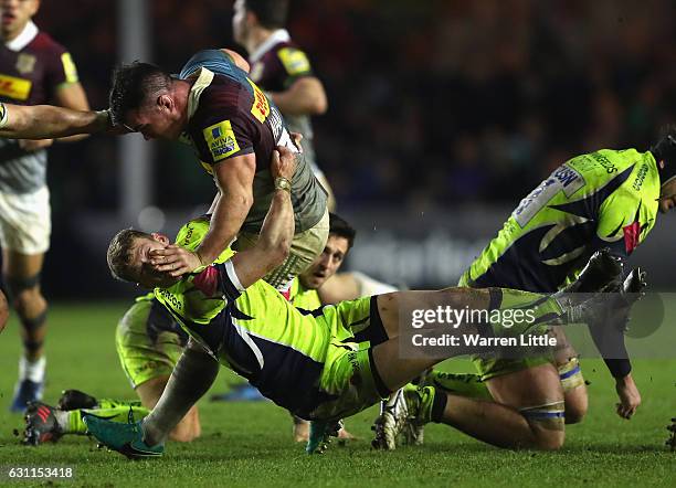 Dave Ward of Harlequins hands off Mike Haley of Sale Sharks during the Aviva Premiership match between Harlequins and Sale Sharks at Twickenham Stoop...