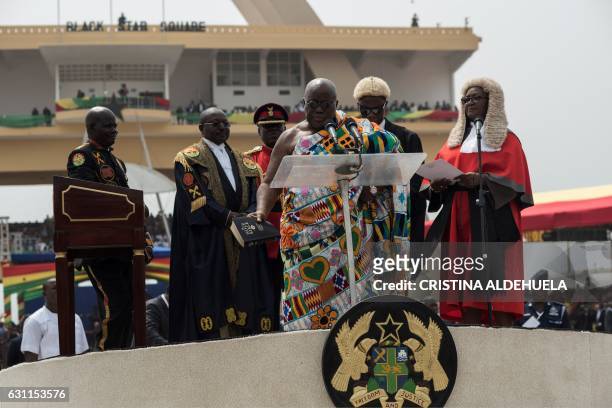 The winner of Ghana's presidential election Nana Akufo-Addo takes the oath of office during the swearing-in as elected President of the fourth...