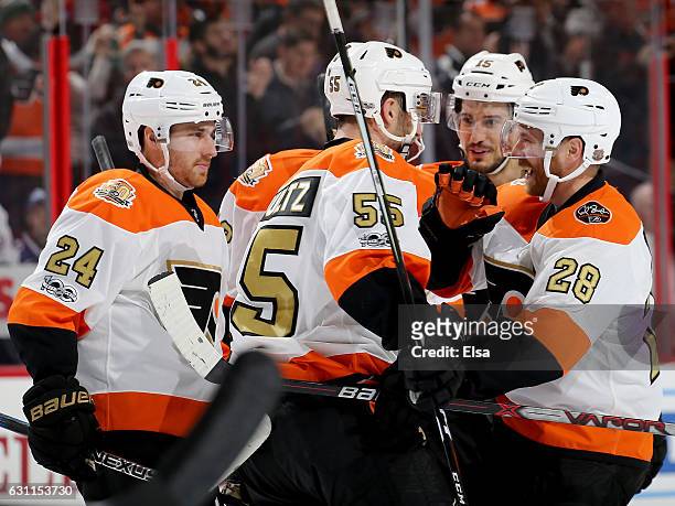 Matt Read,Nick Schultz,Michael Del Zotto and Claude Giroux of the Philadelphia Flyers celebrate Michael Raffl's goal in the second period against the...