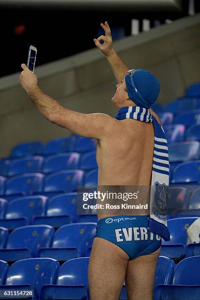 An Everton fan takes a 'selfie' during the Emirates FA Cup third round match between Everton and Leicester City at Goodison Park on January 7, 2017...