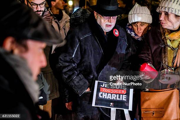 Man holds a sign reading &quot;I am still Charlie&quot; during a rally commemorating the second anniversary of the deadly attack against the...