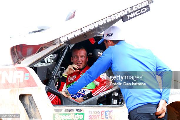 Nicolas Fuchs of Peru and HRX Wevers Sport speaks with a member of his team as he prepares to depart the camp after stage six of the 2017 Dakar Rally...