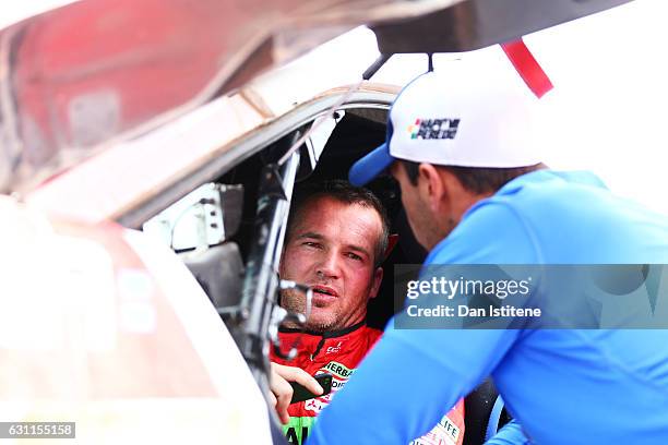 Nicolas Fuchs of Peru and HRX Wevers Sport speaks with a member of his team as he prepares to depart the camp after stage six of the 2017 Dakar Rally...