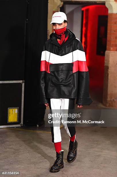 Model walks the runway at the Agi & Sam x The Woolmark Company show during London Fashion Week Men's January 2017 collections at The Welsh Chapel on...