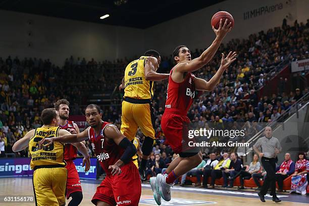 Nick Johnson of Muenchen is challenged by Tekele Cotton of Ludwigsburg during the easyCredit BBL match between MHP Riesen Ludwigsburg and FC Bayern...