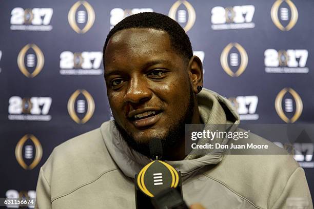 Offensive Tackle Cam Robinson of the Alabama Crimson Tide addresses the media during Media Day before the College Football Playoff National...