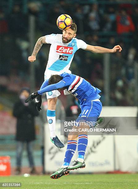 Napoli's defender from Italy Lorenzo Tonelli fights for the ball with Sampdoria's midfielder from Argentina Ricky Alvarez during the Italian Serie A...