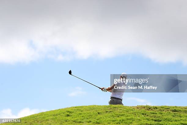 Justin Thomas of the United States plays his shot from the fifth tee during the third round of the SBS Tournament of Champions at the Plantation...