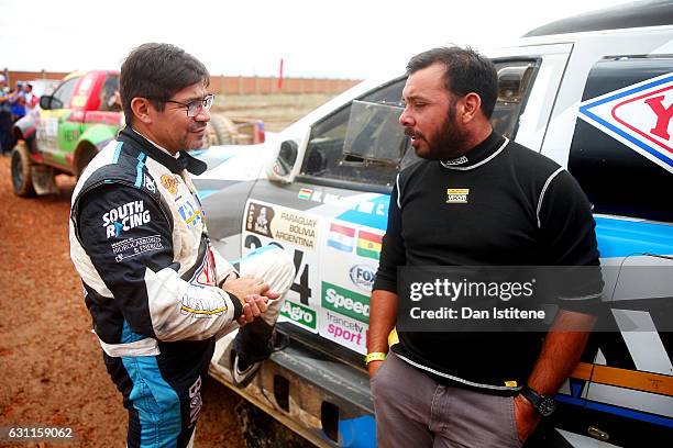 Marco Bulacia of Bolivia and Ford South Racing speaks with a member of his team as he prepares to depart the camp after stage six of the 2017 Dakar...