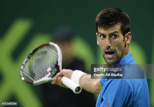 Novak Djokovic of Serbia reacts after losing a point against Andy Murray of Great Britain during the men's singles final match of the ATP Qatar Open...