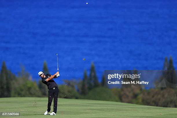 Dustin Johnson of the United States plays a shot on the fourth hole during the third round of the SBS Tournament of Champions at the Plantation...