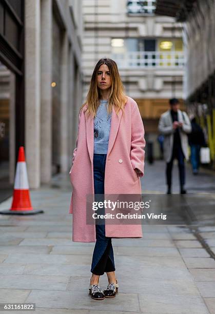 Marta Represa wearing a pink wool coat during London Fashion Week Men's January 2017 collections at Lou Dalton on January 7, 2017 in London, England.