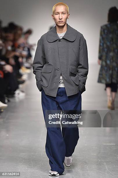 Model walks the runway at the Casely-Hayford Autumn Winter 2017 fashion show during London Menswear Fashion Week on January 7, 2017 in London, United...