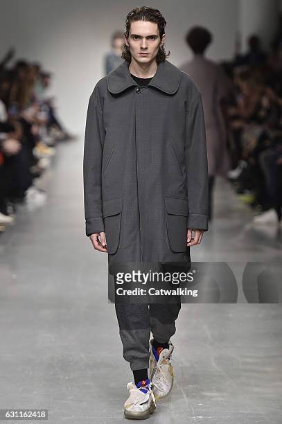 Model walks the runway at the Casely-Hayford Autumn Winter 2017 fashion show during London Menswear Fashion Week on January 7, 2017 in London, United...