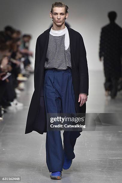 Model walks the runway at the Casely-Hayford Autumn Winter 2017 fashion show during London Menswear Fashion Week on January 7, 2017 in London, United...