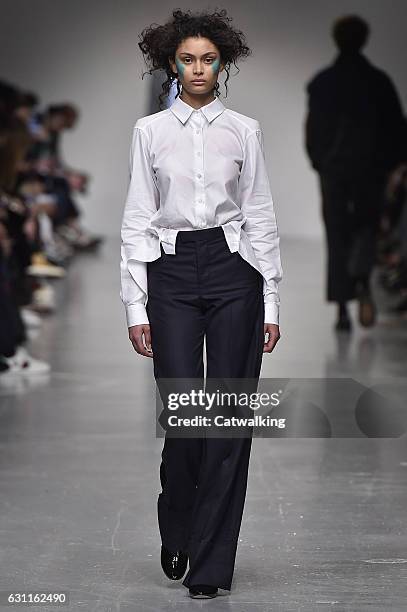 Model walks the runway at the Casely-Hayford Autumn Winter 2017 fashion show during London Menswear Fashion Week on January 7, 2017 in London, United...