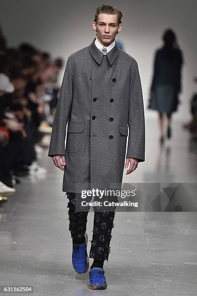 Model walks the runway at the Casely-Hayford Autumn Winter 2017 fashion show during London Menswear Fashion Week on January 7, 2017 in London, United...