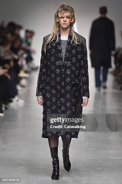 Model walks the runway at the Casely-Hayford Autumn Winter 2017 fashion show during London Menswear Fashion Week on January 7, 2017 in London, United...