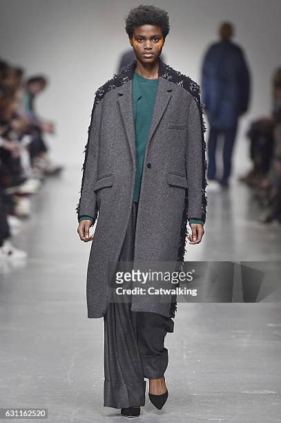 Model walks the runway at the Casely-Hayford Autumn Winter 2017 fashion show during London Menswear Fashion Week on January 7, 2017 in London, United...