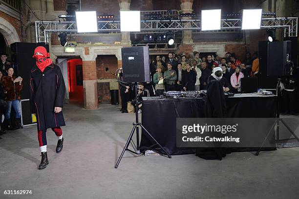 Model walks the runway at the Agi & Sam Autumn Winter 2017 fashion show during London Menswear Fashion Week on January 7, 2017 in London, United...