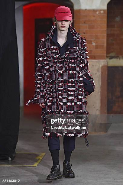 Model walks the runway at the Agi & Sam Autumn Winter 2017 fashion show during London Menswear Fashion Week on January 7, 2017 in London, United...