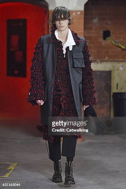 Model walks the runway at the Agi & Sam Autumn Winter 2017 fashion show during London Menswear Fashion Week on January 7, 2017 in London, United...