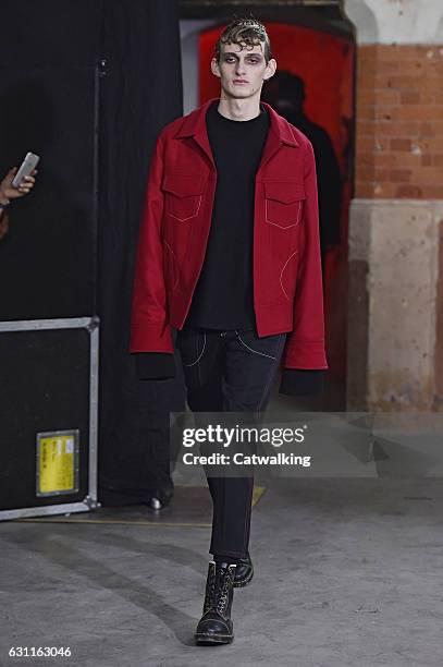 Model walks the runway at the Agi & Sam Autumn Winter 2017 fashion show during London Menswear Fashion Week on January 7, 2017 in London, United...