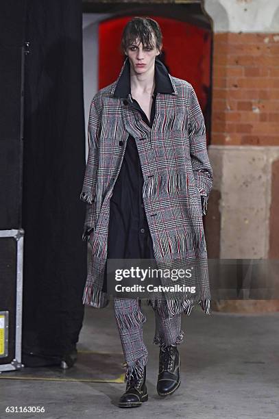 Model walks the runway at the Agi & Sam Autumn Winter 2017 fashion show during London Menswear Fashion Week on January 7, 2017 in London, United...