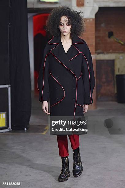 Model walks the runway at the Agi & Sam Autumn Winter 2017 fashion show during London Menswear Fashion Week on January 7, 2017 in London, United...