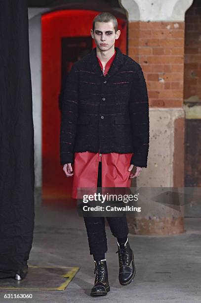 Model walks the runway at the Agi & Sam Autumn Winter 2017 fashion show during London Menswear Fashion Week on January 7, 2017 in London, United...