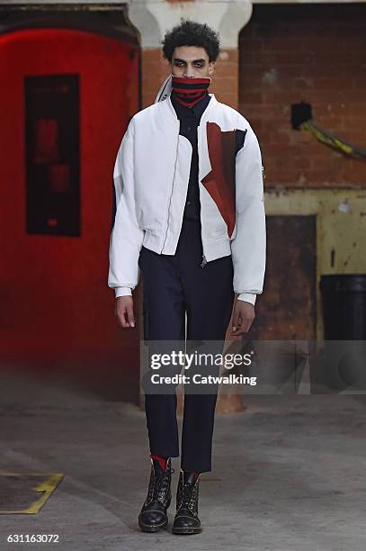 Model walks the runway at the Agi & Sam Autumn Winter 2017 fashion show during London Menswear Fashion Week on January 7, 2017 in London, United...