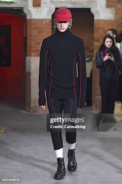 Model walks the runway at the Agi & Sam Autumn Winter 2017 fashion show during London Menswear Fashion Week on January 7, 2017 in London, United...