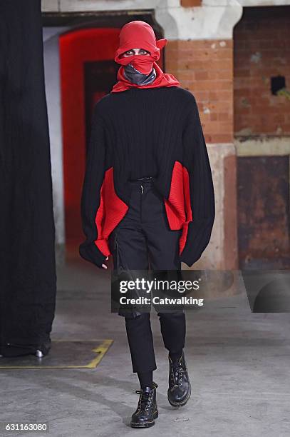 Model walks the runway at the Agi & Sam Autumn Winter 2017 fashion show during London Menswear Fashion Week on January 7, 2017 in London, United...