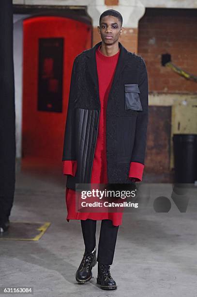 Model walks the runway at the Agi & Sam Autumn Winter 2017 fashion show during London Menswear Fashion Week on January 7, 2017 in London, United...