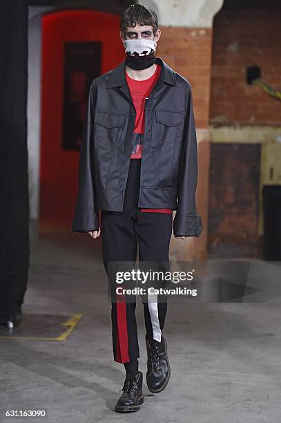 Model walks the runway at the Agi & Sam Autumn Winter 2017 fashion show during London Menswear Fashion Week on January 7, 2017 in London, United...