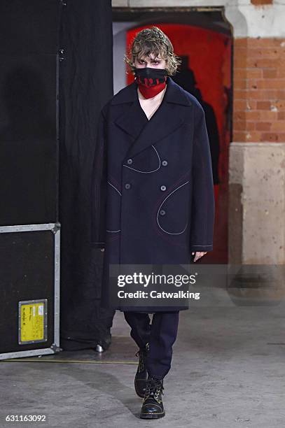 Model walks the runway at the Agi & Sam Autumn Winter 2017 fashion show during London Menswear Fashion Week on January 7, 2017 in London, United...