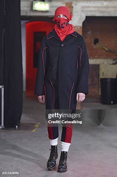 Model walks the runway at the Agi & Sam Autumn Winter 2017 fashion show during London Menswear Fashion Week on January 7, 2017 in London, United...